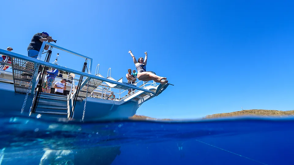 Guest on the Pride of Maui Slide