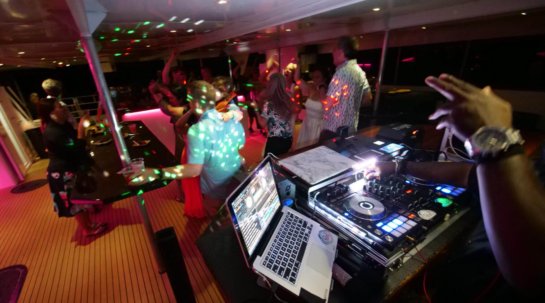 Guests Dancing While DJ plays Music on a Pride of Maui Private Charter