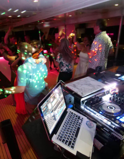 Guests Dancing While DJ plays Music on a Pride of Maui Private Charter