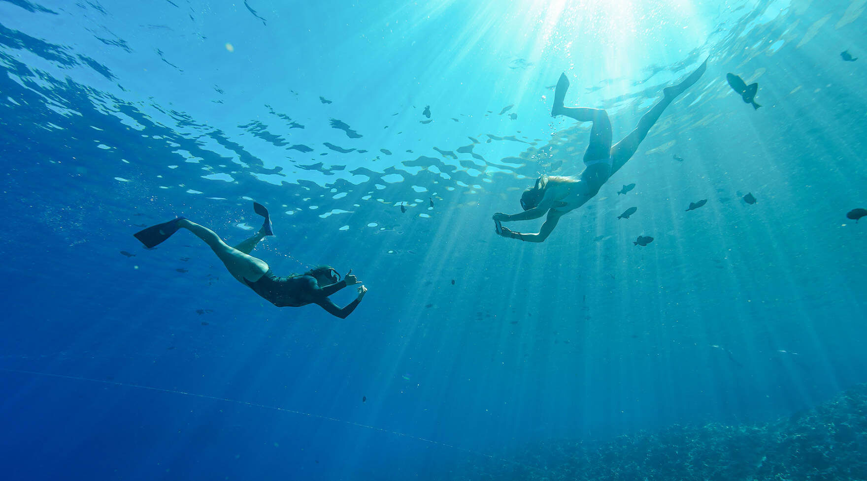 Two Guests Snorkeling Underwater Near Molokini