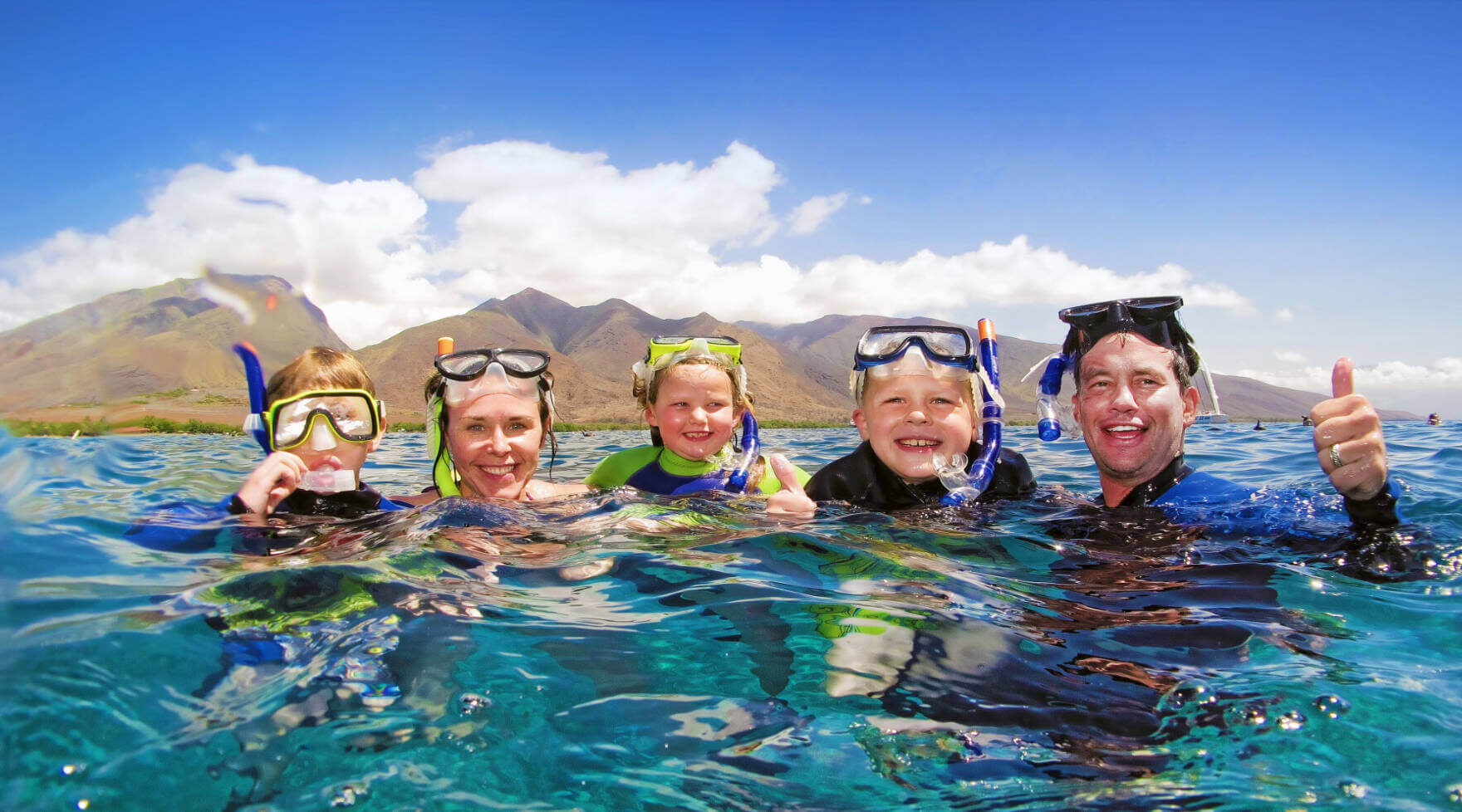 Family in the Water on a Pride of Maui Snorkel Cruise