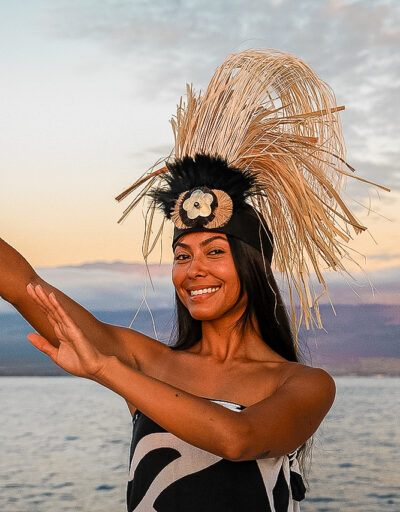 Hawaiian hula dancer performing on deck at sunset during the Pride of Maui Dinner Cruise