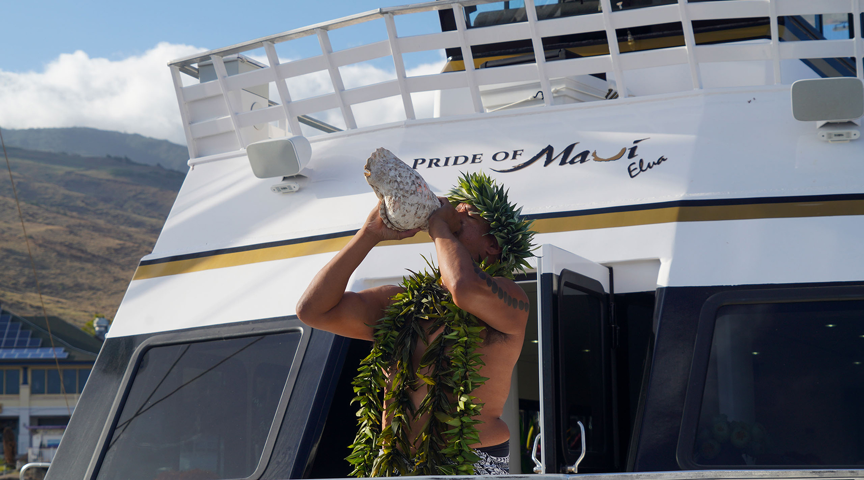 Performer Blowing Conch Shell on Pride of Maui 'Elua Wedding Cruise