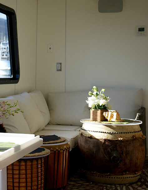 Air-conditioned lounge with shaded seating aboard the ‘Elua catamaran.